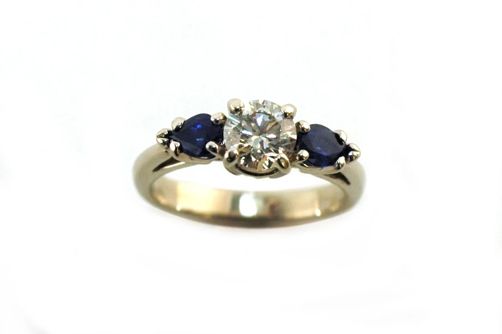 A diamond and sapphire ring is shown here.