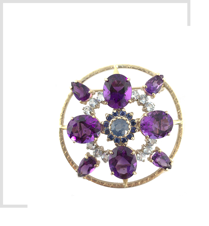 A gold circle with purple stones on it.