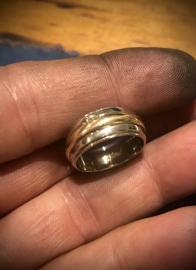 A person holding a ring in their hand